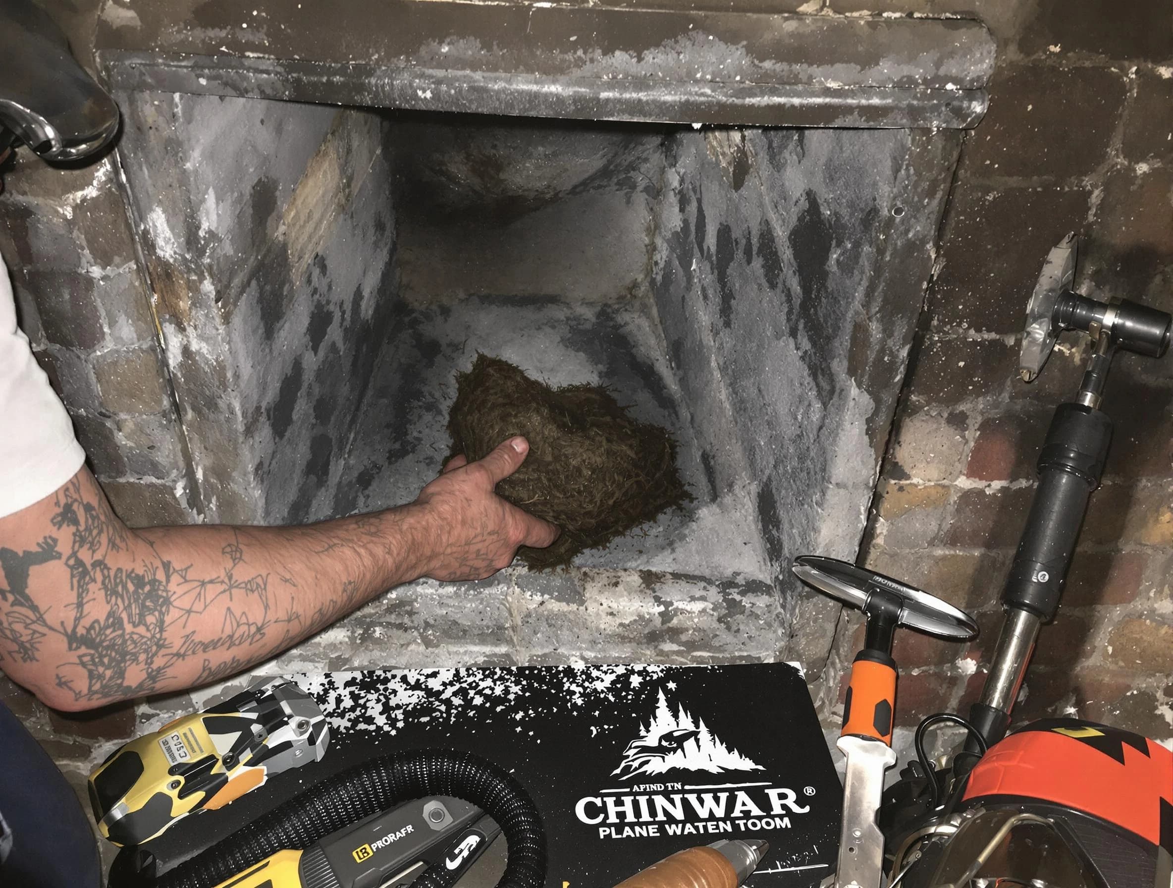 Summit Chimney Sweep safely removing debris and screening chimney in Summit, NJ